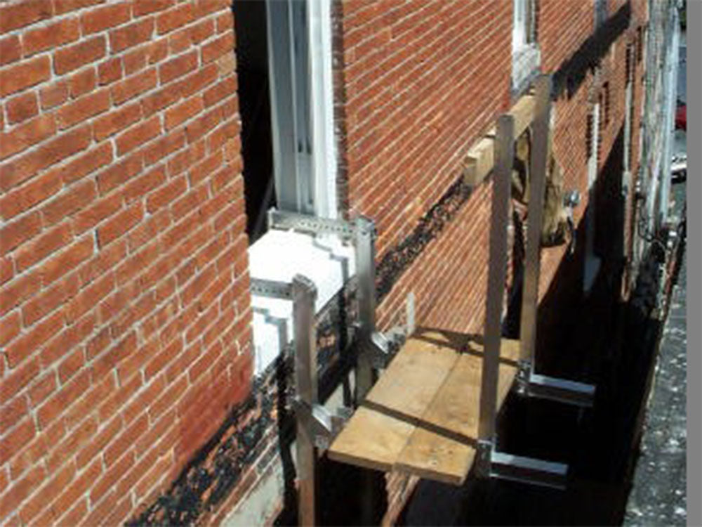 Wall Walker in use for window work, where stabilizer bars support the beam across the opening