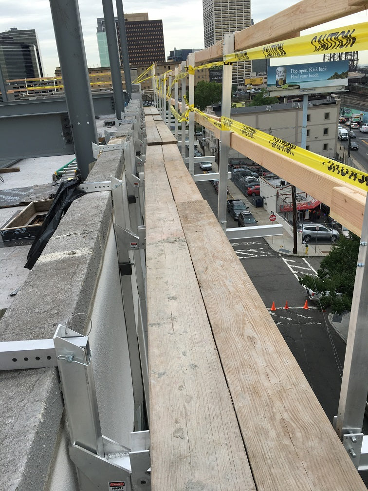 Wall-Walker-hanging-scaffold-in-use-on-a-jobsite